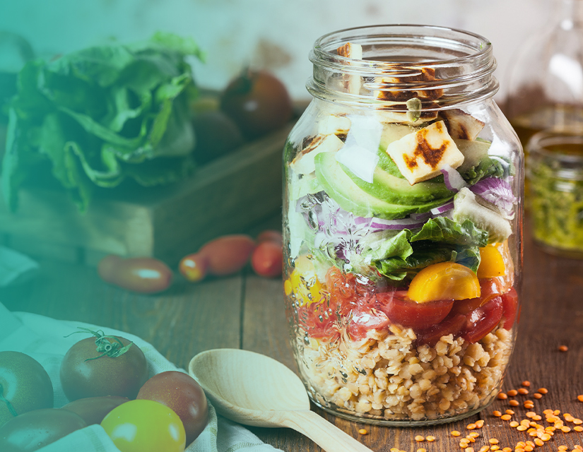 Jar filled with healthy salad ingredients